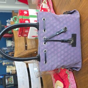 Dooney & Bourke Tassel Tote in a purple signature canvas with black leather trim